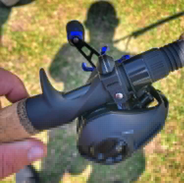 Person holding a fishing pole with Line Cutterz Fishing Line Cutter attached