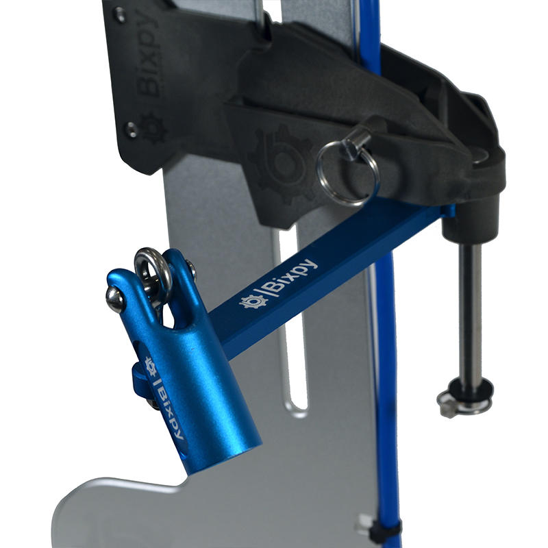 Close-up of the upper section of a Bixpy rudder adapter, showing its black clamping mechanism, blue adjustment lever with ring, and connection to a blue vertical shaft.