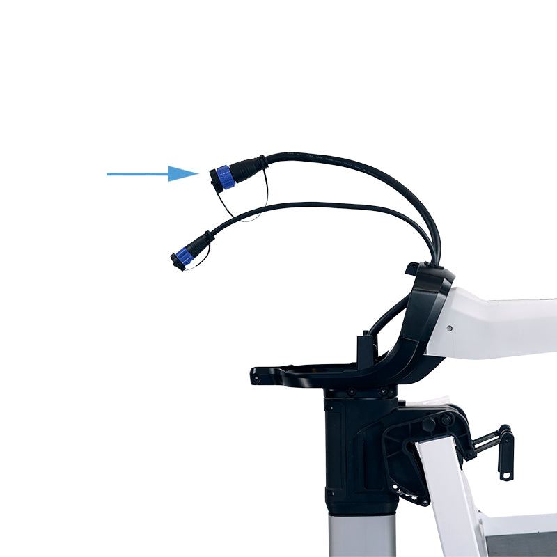 Close-up of the top of a white Bixpy electric outboard motor, showing two black cables with blue connectors, with an arrow pointing to the motor cable cap.
