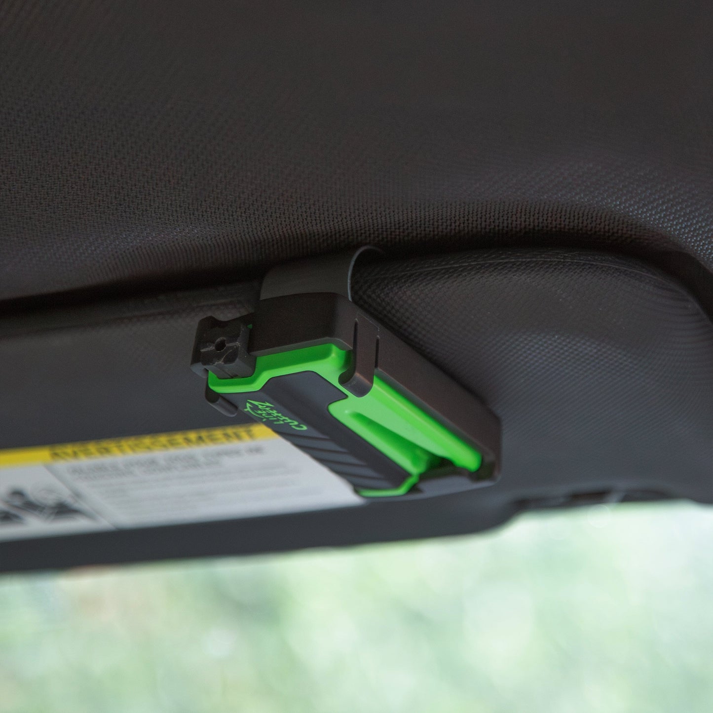 Line Cutterz "VET" Vehicle Escape Tool clipped to a sun visor