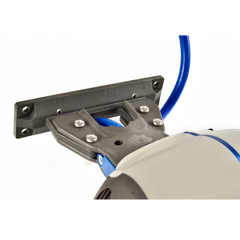 Close-up of a white Bixpy Jet electric motor connected to a black mounting adapter with a blue cable and visible hardware.