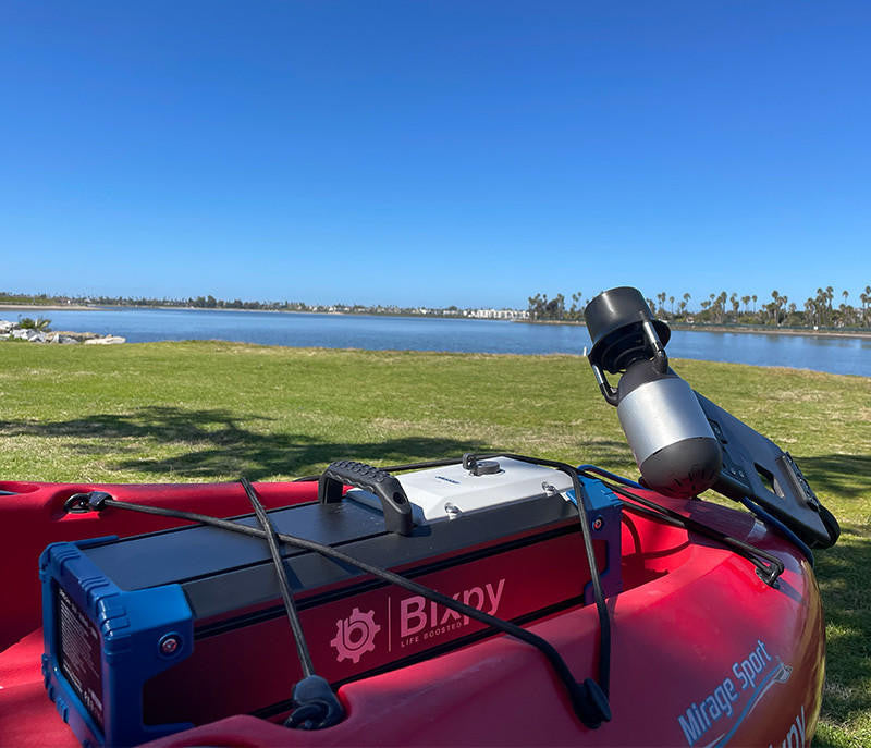 Bixpy Jet Motor and Battery Pack installed on a kayak, ready for use on the water.