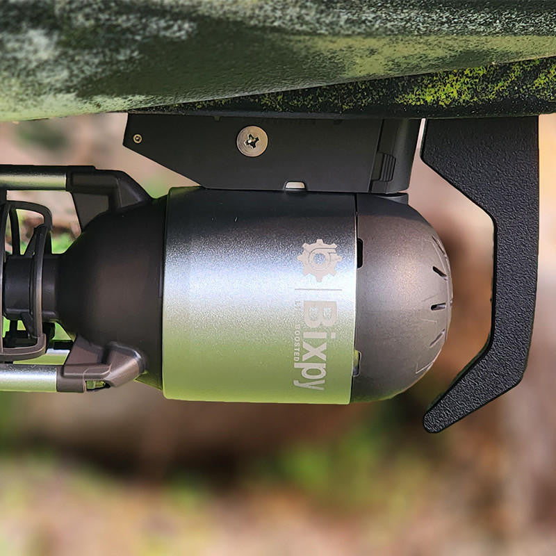 Very close-up, bottom view of a Bixpy Jet electric motor mounted beneath an olive green kayak with a dark, rigid adapter.