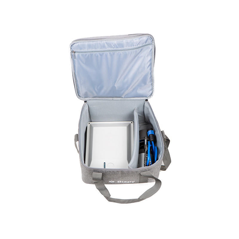 Top-down view of the travel bag with the lid open, showing internal compartments and space for Bixpy gear.