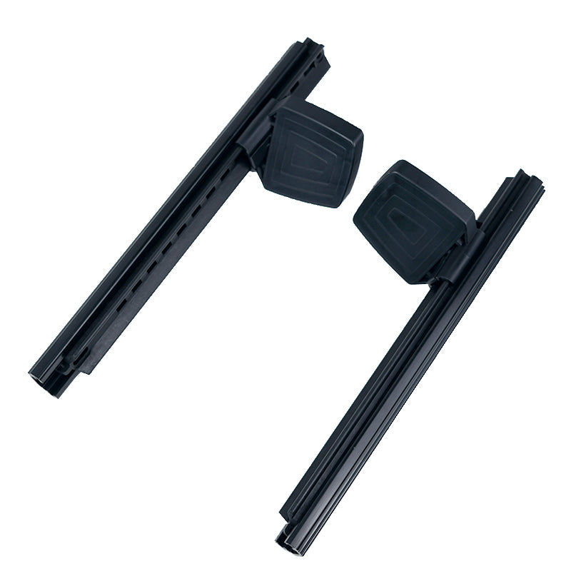 Two identical black Foot Pedal Steering System tracks with a square raised section each, angled on a white background.