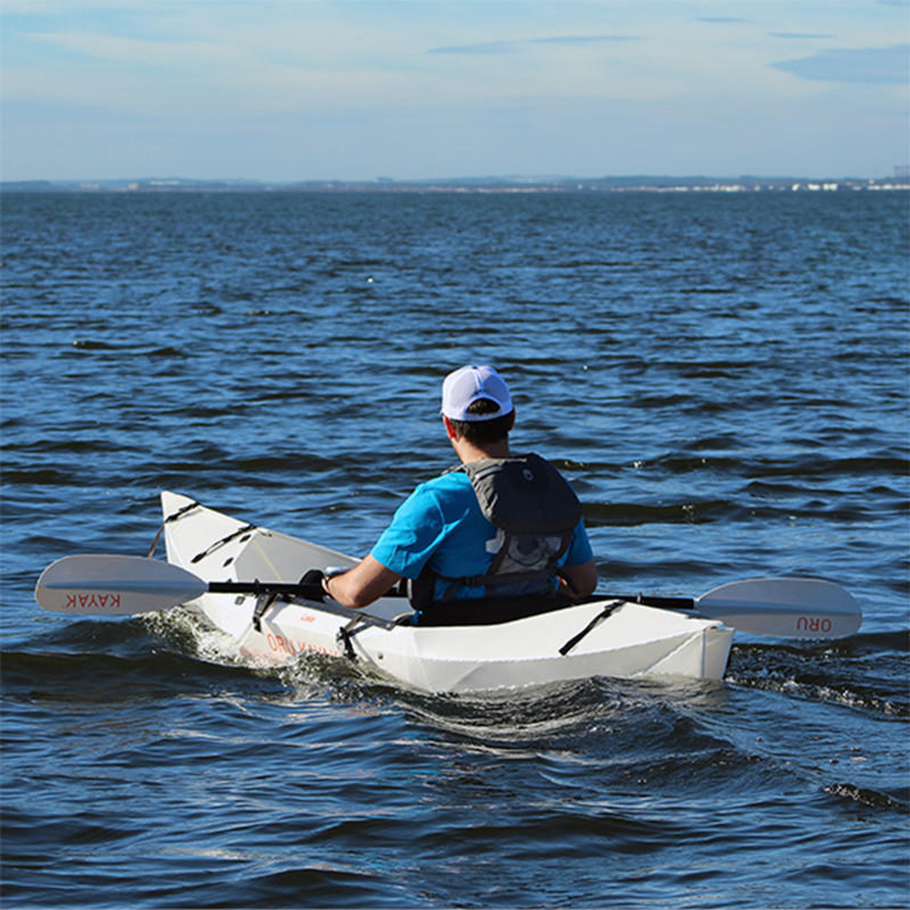 Man paddling Oru Kayak with Bixpy adapter kit