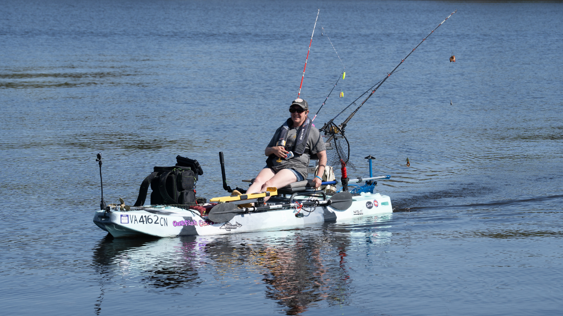 a woman on a kayak with Bixpy motor on it