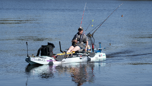 a woman on a kayak with Bixpy motor on it