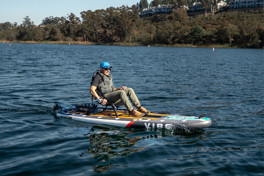 Man rides on Vibe Kayak to learn 4 Easy Ways to Motorize Your Vibe Uptown 100 Lite Kayak with a Bixpy Motor
