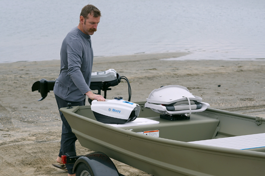 Man attaching the Bixpy N-3 to a jon boat