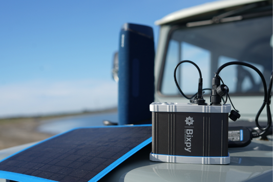 Bixpy power bank using a solar panel for charging while powering other devices