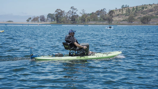 man kayaking with bixpy motor and power pack on a lake