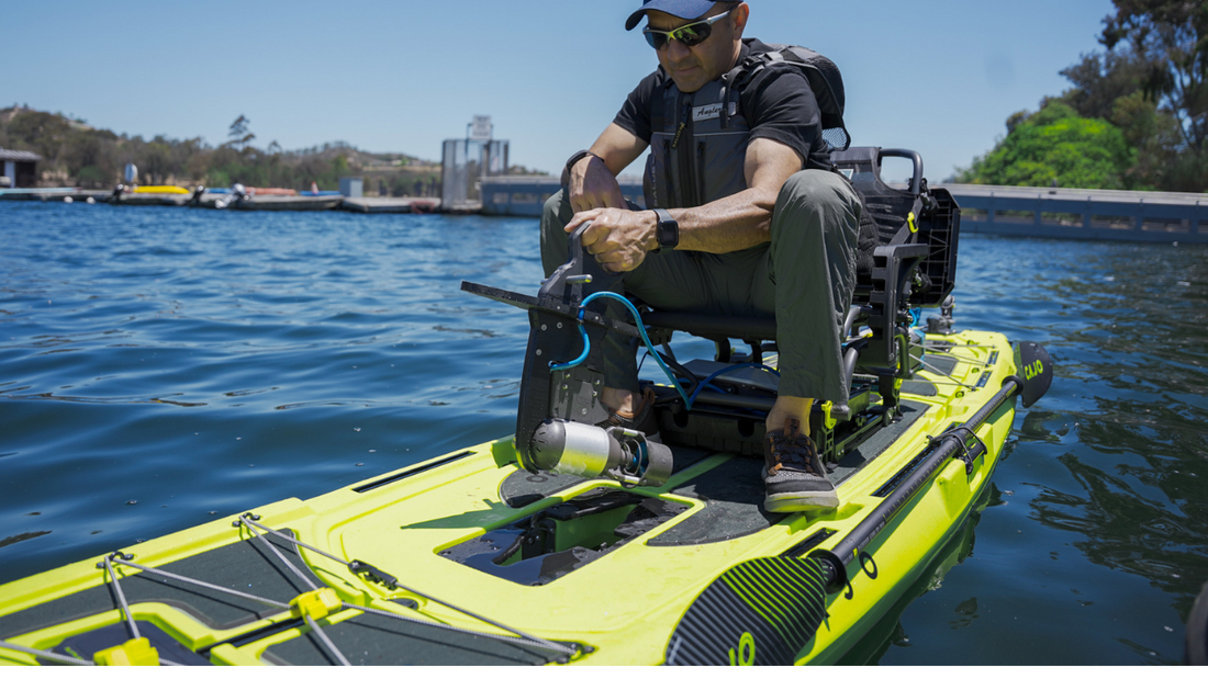 a man putting in pedal drive adapter with bixpy motor onto a kayak