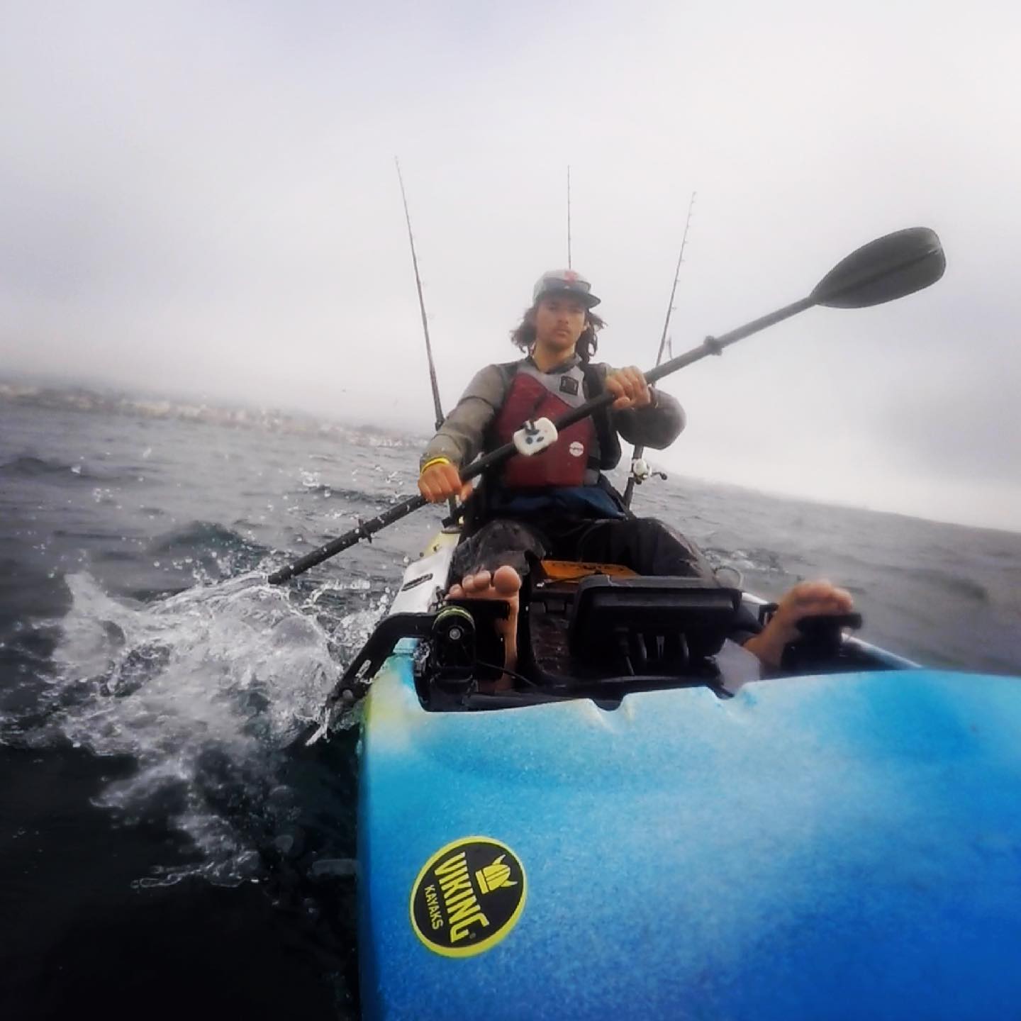 Man in kayak in cold water using a Bixpy motor