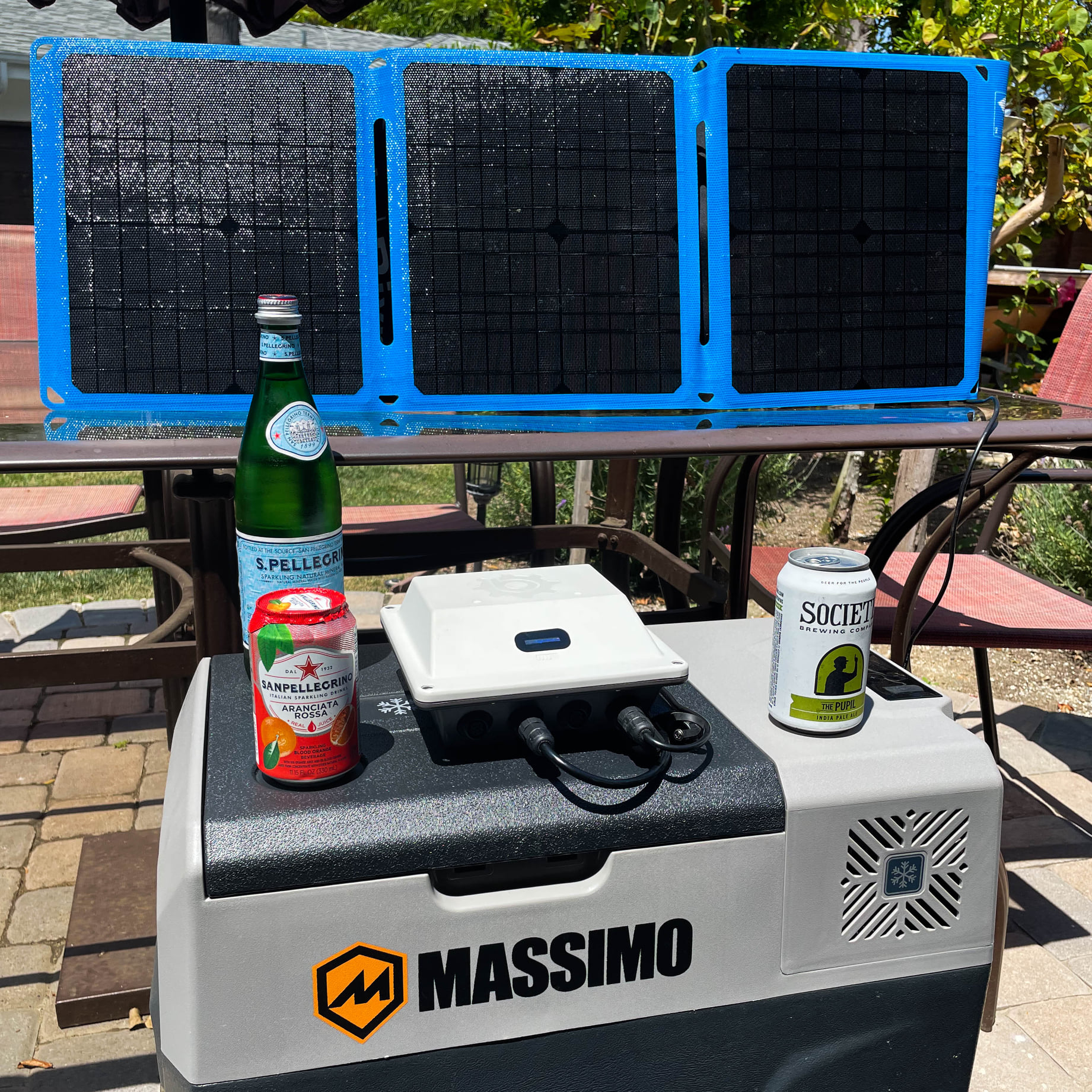 Cooler with drinks and Bixpy solar panel and power bank