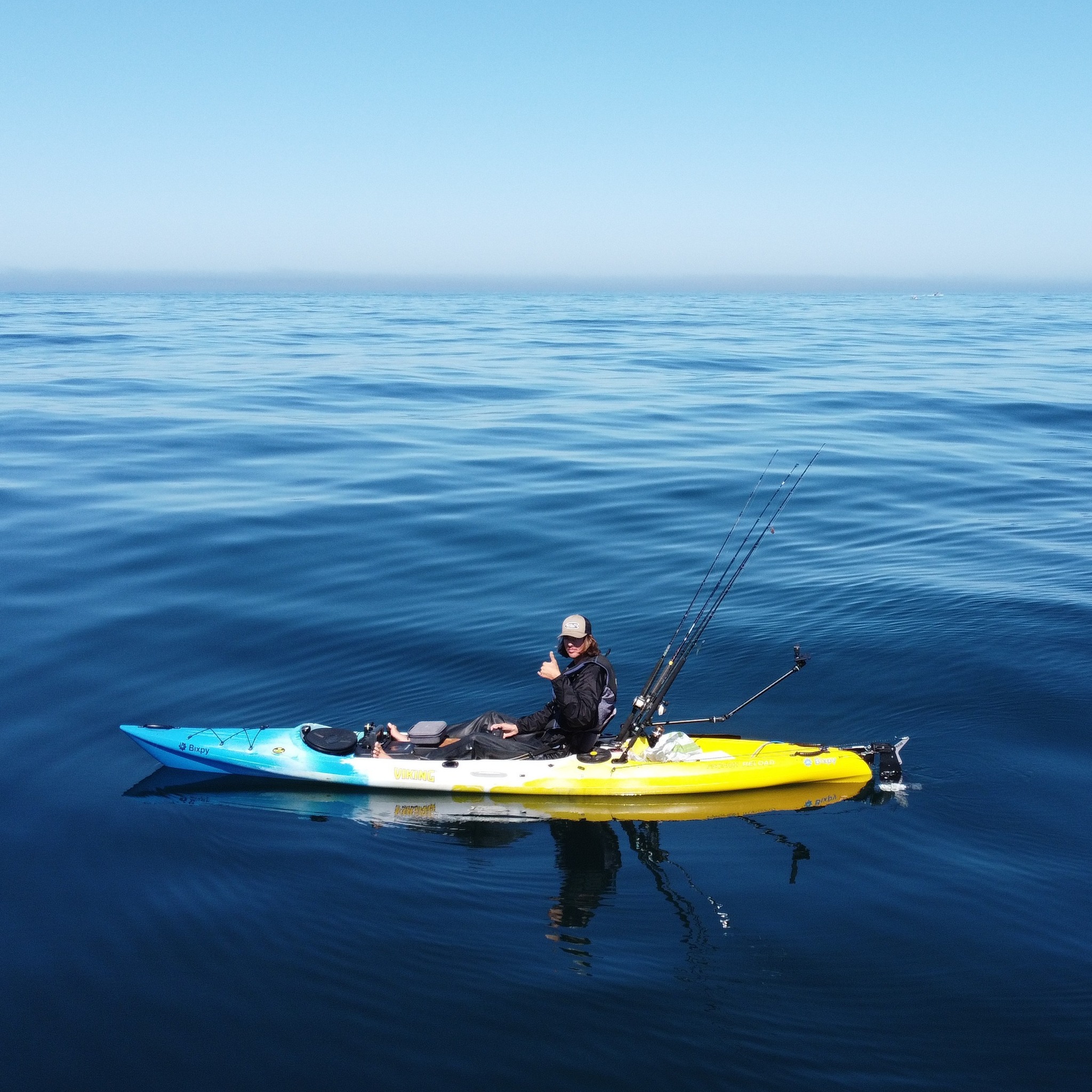 Man fishing in a kayak with a Bixpy Motor