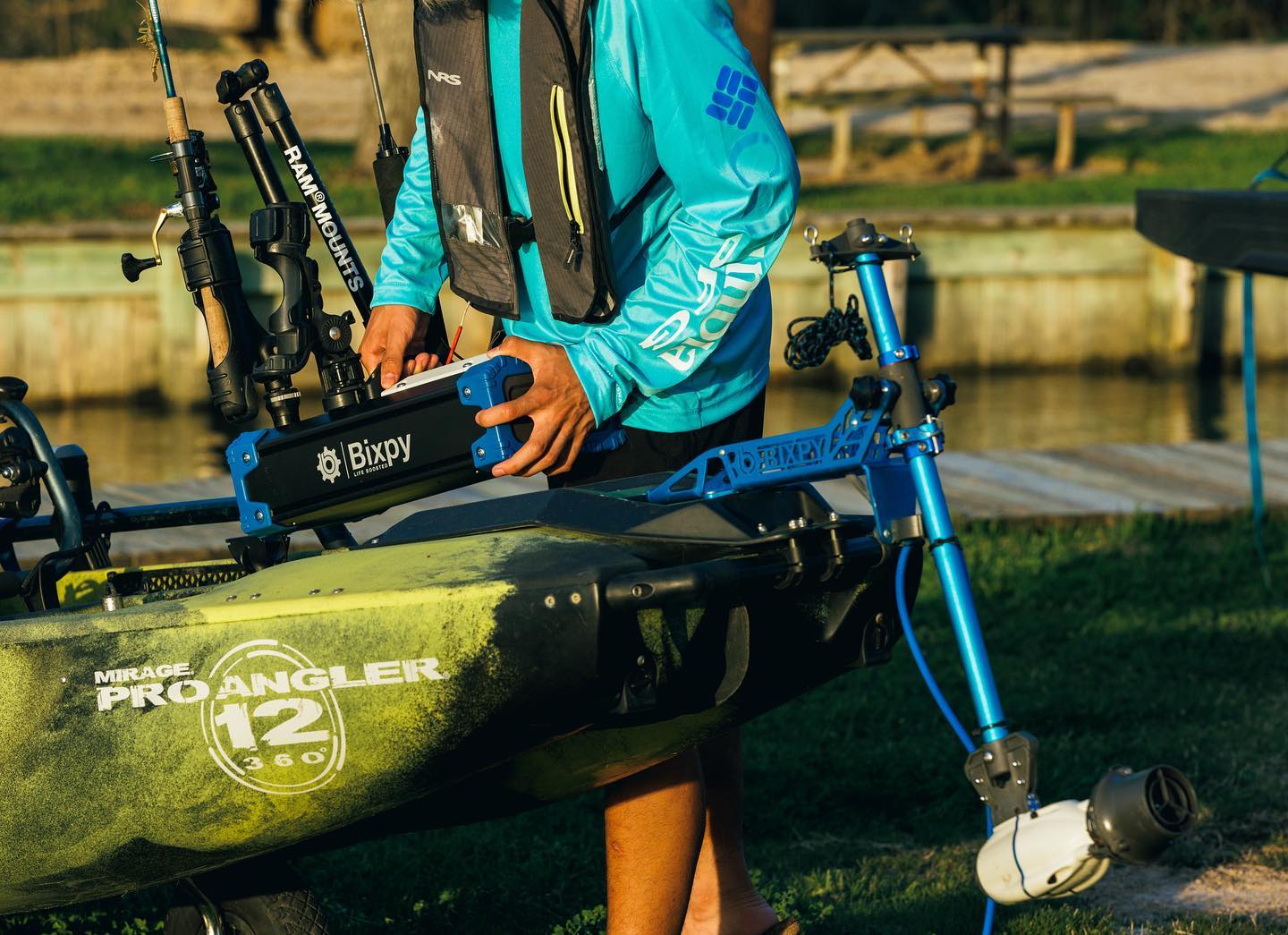 Bixpy battery being placed on a Pro Angler kayak that features a Bixpy K-1 Motor