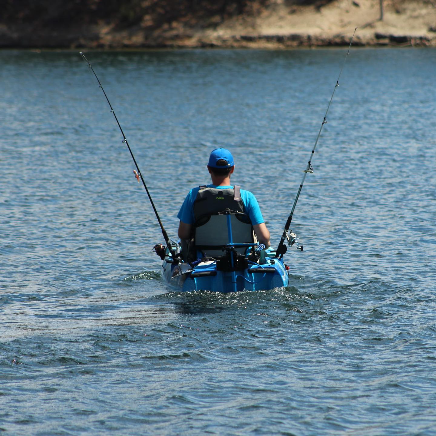 Man fishing in kayak using Bixpy motor