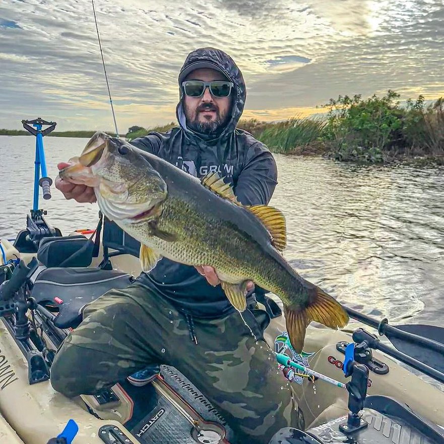 Man holding up fish he caught using Bixpy K-1 Angler Kit