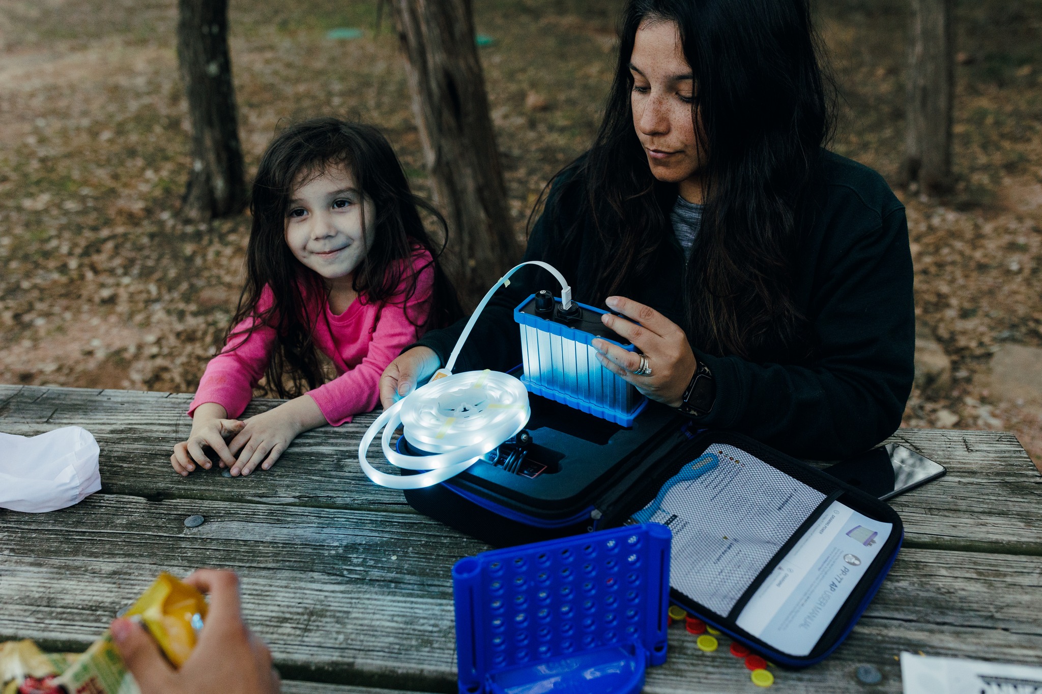 Mom and child using Bixpy PP-77-AP battery to power lights
