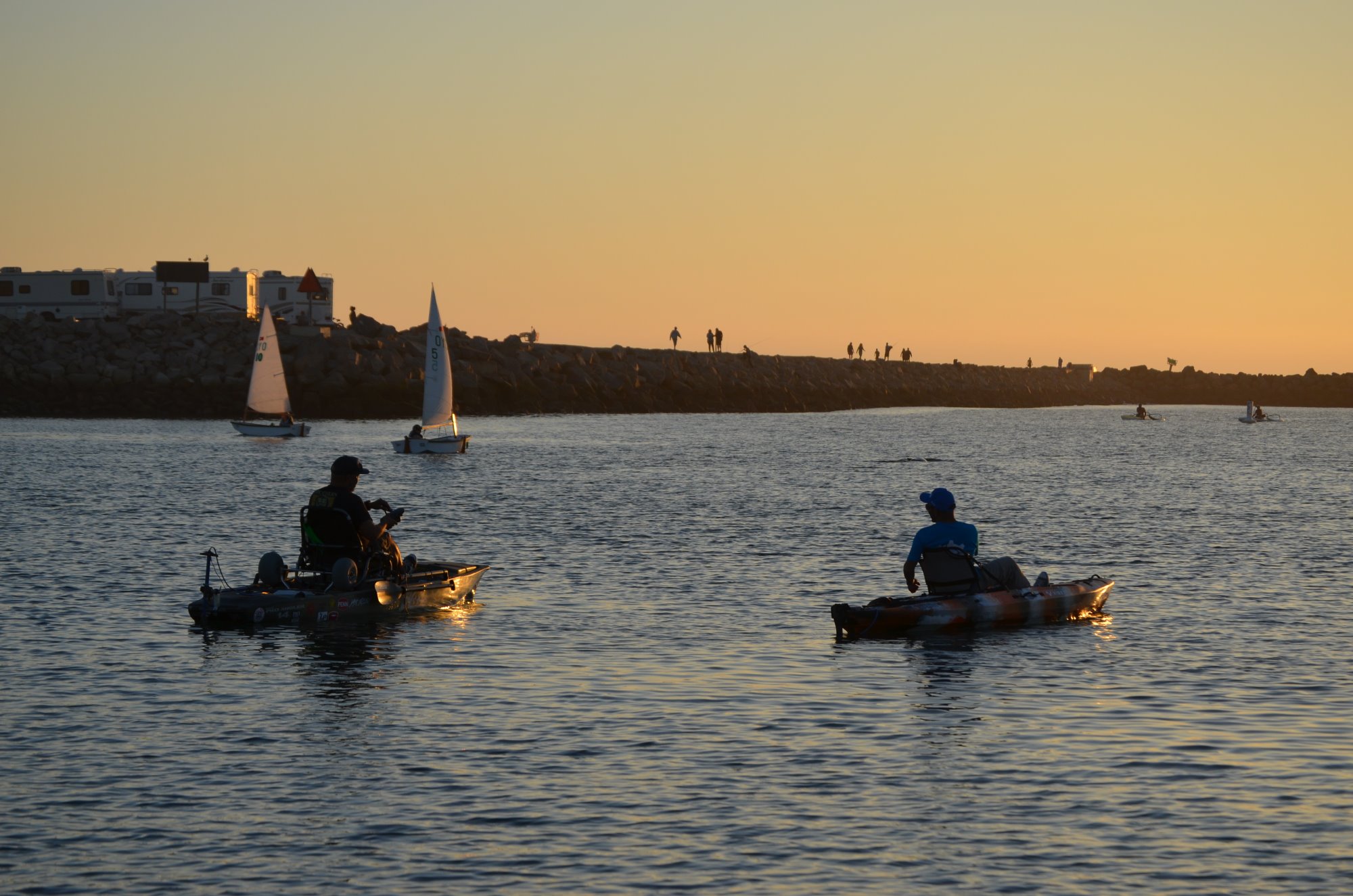 Two kayaks with Bixpy motors at sunset